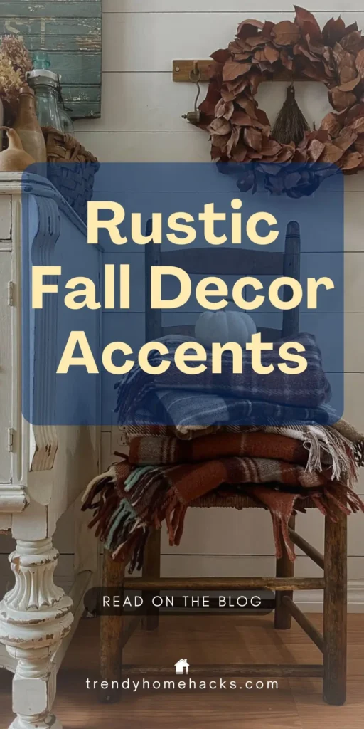 Cozy fall vignette featuring a rustic chair stacked with plaid blankets and a white pumpkin, with a dried leaf wreath and vintage accents in the background. Text overlay reads “Rustic Fall Decor Accents.”