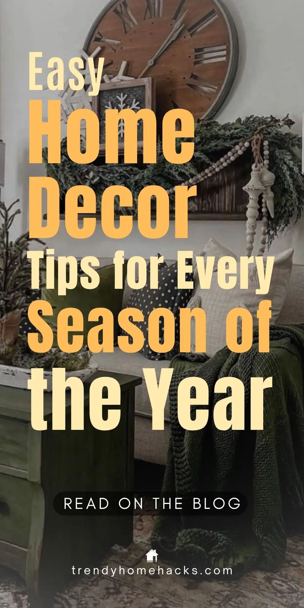 Styled living room with cozy green and neutral decor, a large wooden clock, greenery garland, throw pillows, and seasonal accents. Text overlay reads “Easy Home Decor Tips for Every Season of the Year.”