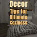 A cozy winter living room featuring a chunky knit blanket, soft neutral pillows, candles, and minimal decor, creating a serene hygge-inspired space perfect for warmth and relaxation.