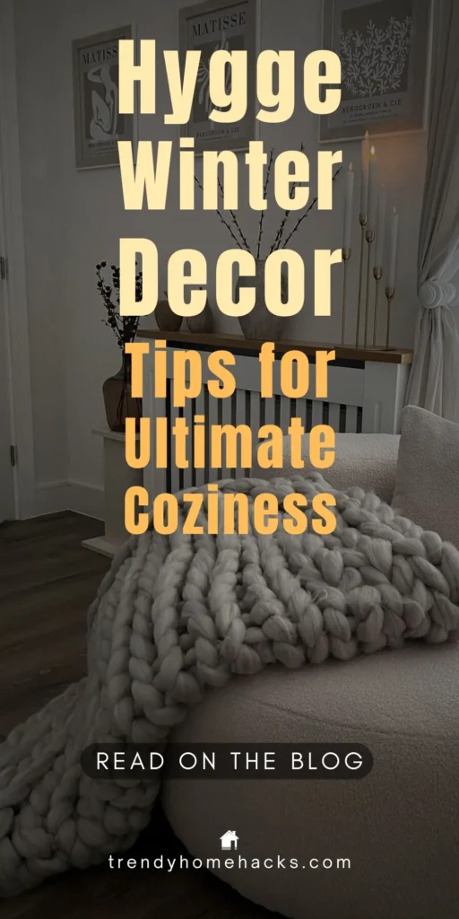 A cozy winter living room featuring a chunky knit blanket, soft neutral pillows, candles, and minimal decor, creating a serene hygge-inspired space perfect for warmth and relaxation.