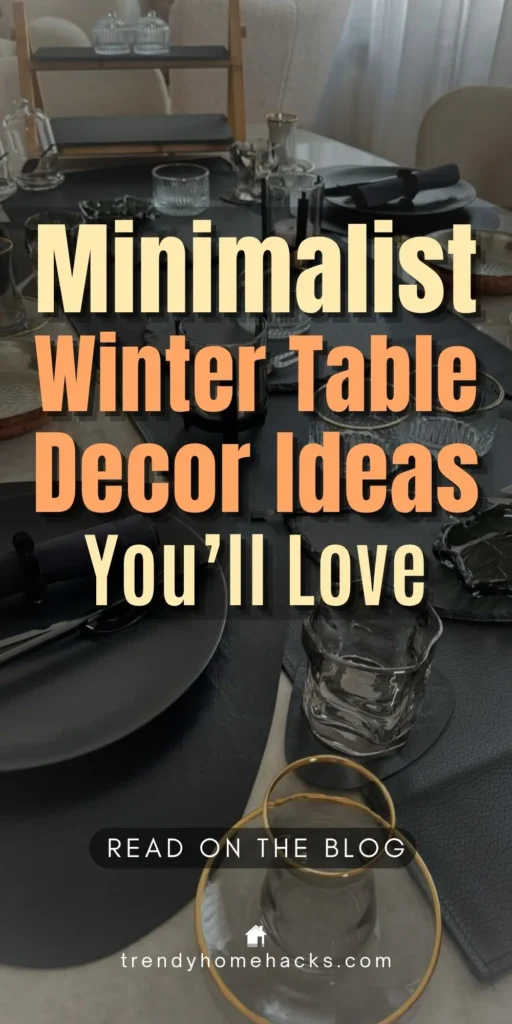 A minimalist winter table setting featuring black plates, dark napkins, gold-rimmed glassware, and simple candle holders arranged on a black leather placemat. Overlay text reads: "Minimalist Winter Table Decor Ideas You’ll Love."