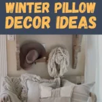 Farmhouse entryway bench styled with layered winter pillows in neutral tones, chunky knit blankets, a cozy scarf, boots, and a tote bag creating a warm rustic winter decor look.