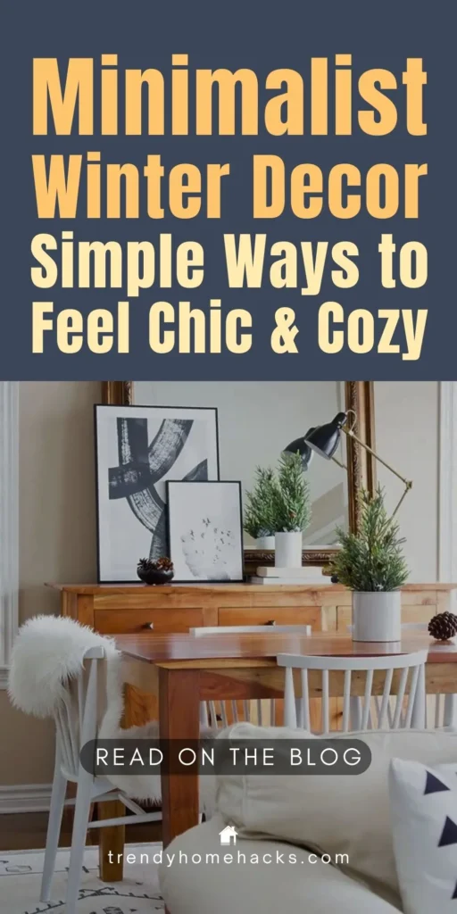 Minimalist winter decor featuring neutral tones, wooden table, framed modern artwork, simple winter greenery, and cozy textures in a bright, modern living space.